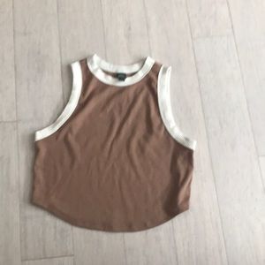 A pinkish tan crop top